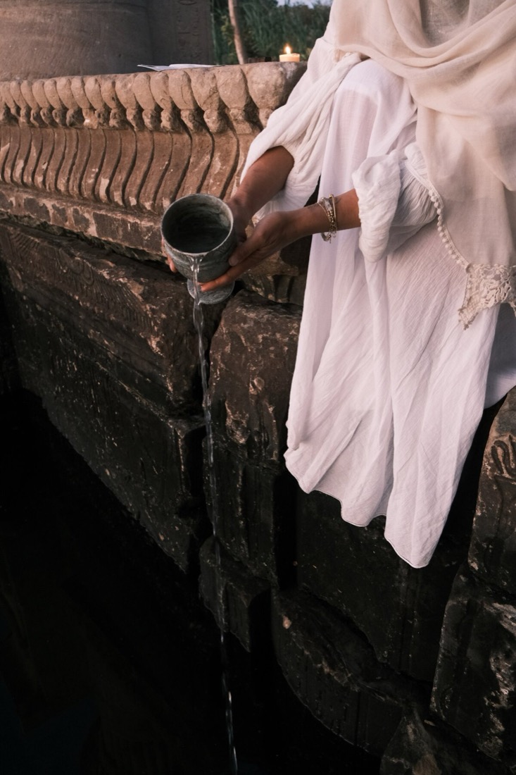 Soft light on sacred water during ceremony
